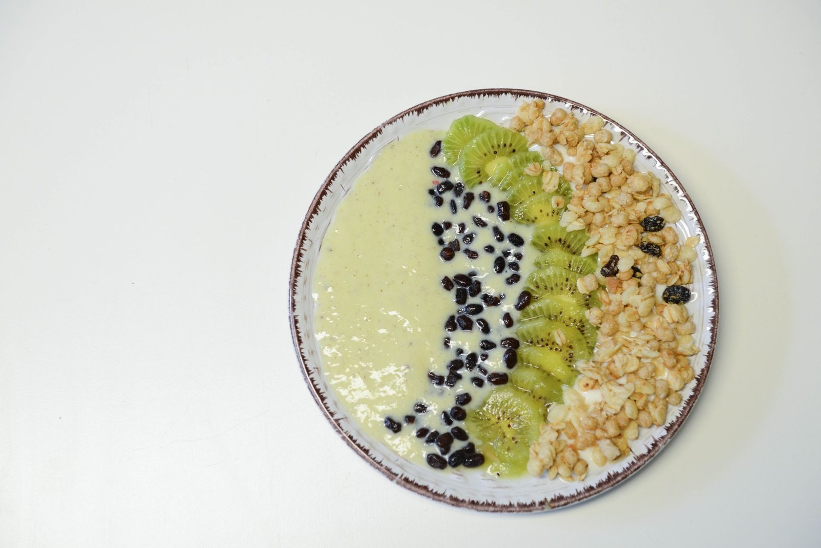 Photograph of a kefir smoothie bowl with fruit and nuts