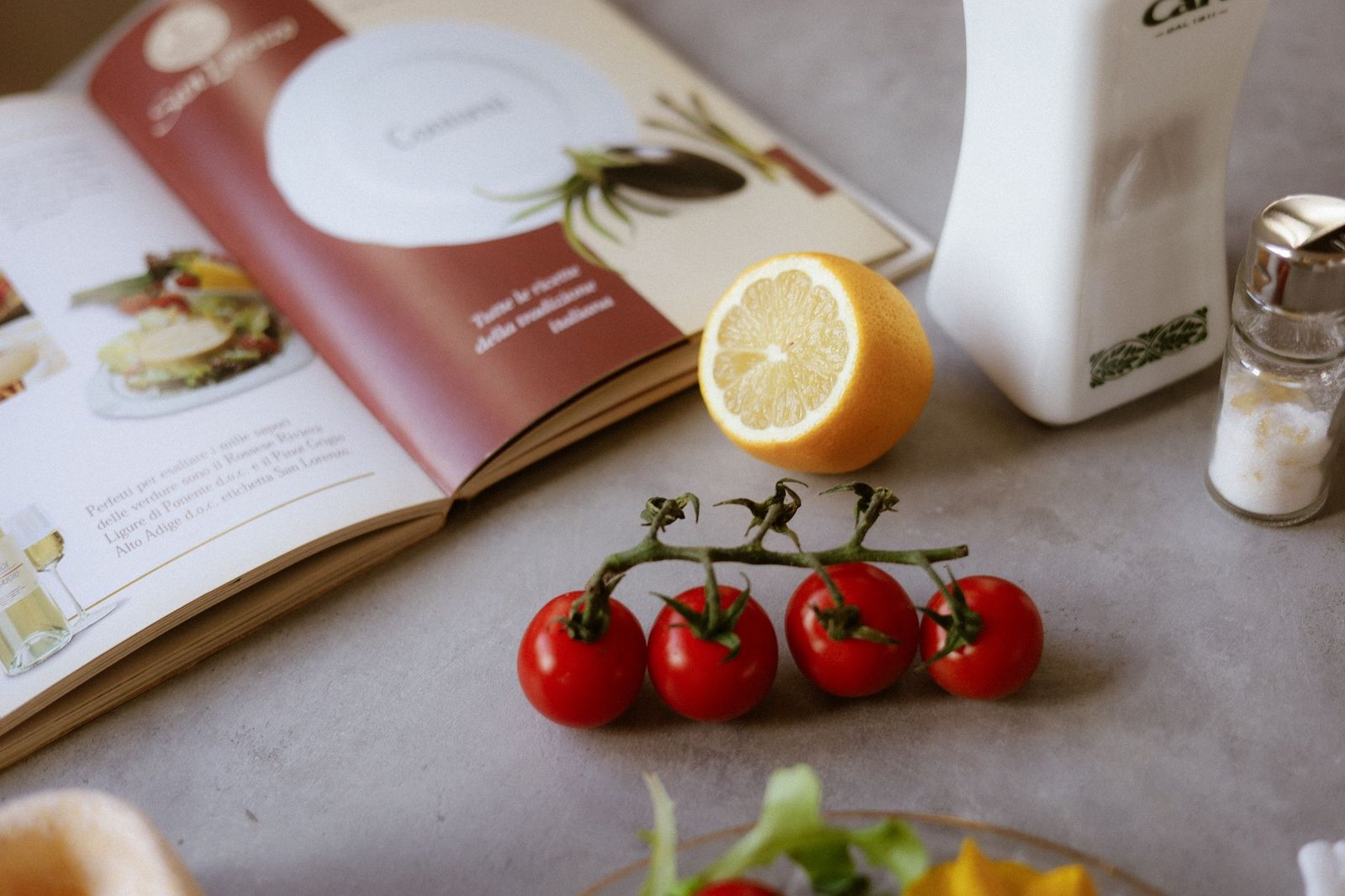 A person planning their Mediterranean diet meals with a calendar and recipe book