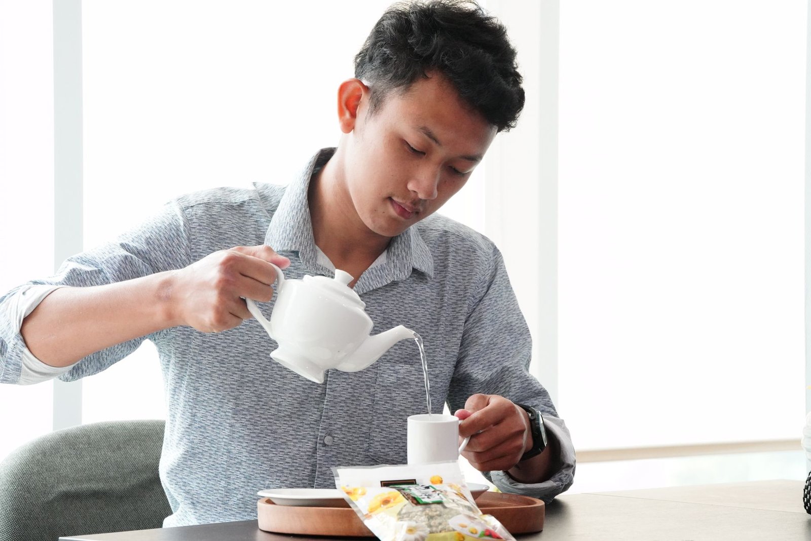 A person enjoying a cup of sage tea in the morning