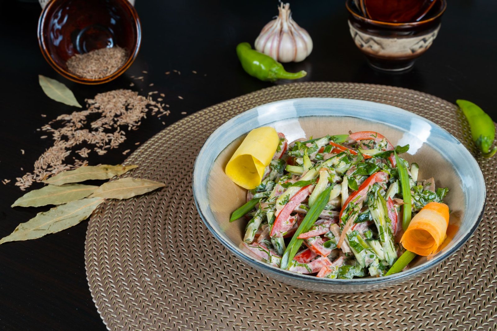 A veggie-packed salad with mixed greens, cherry tomatoes, and cucumber