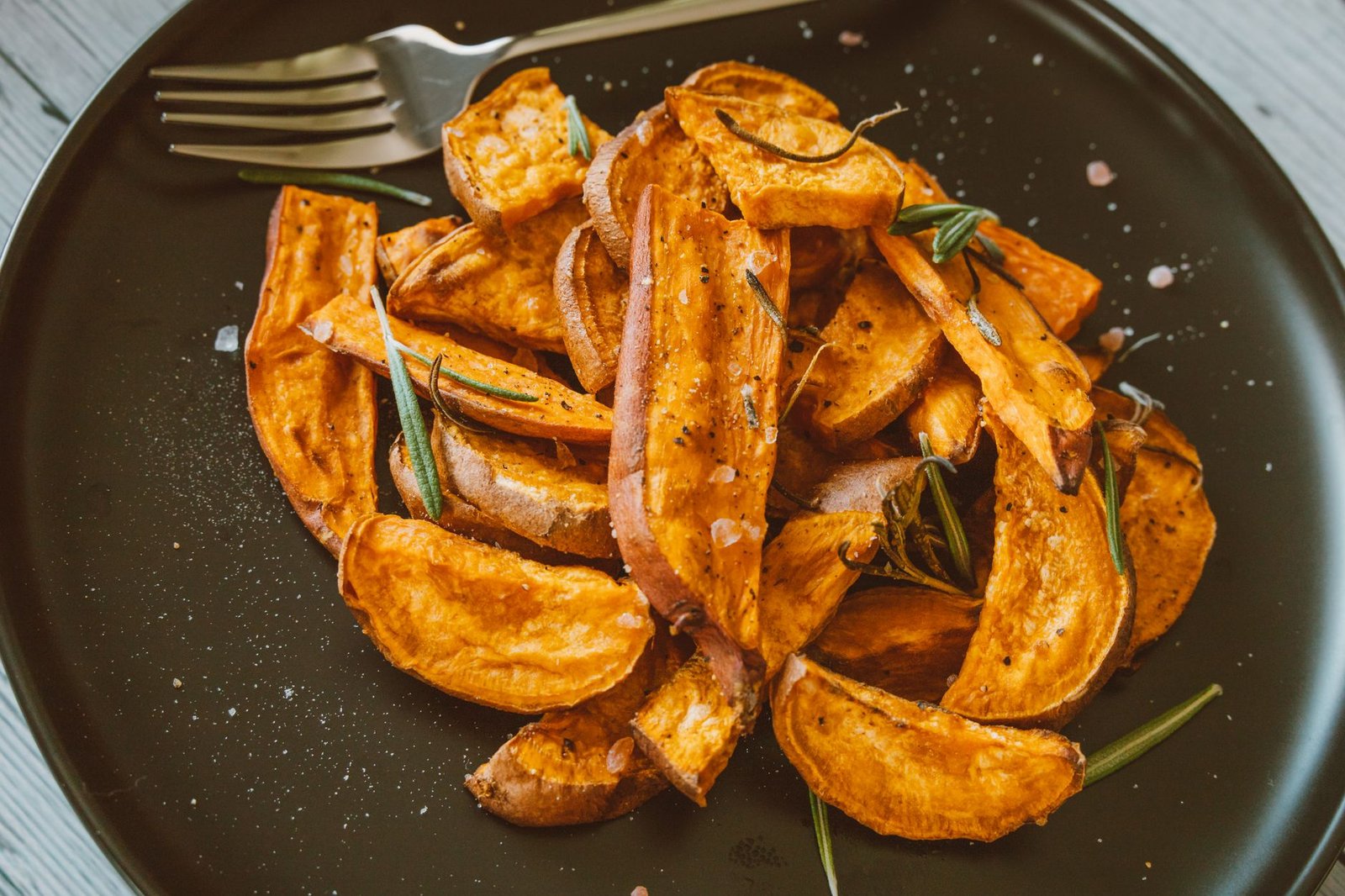 Image of an athlete eating a sweet potato