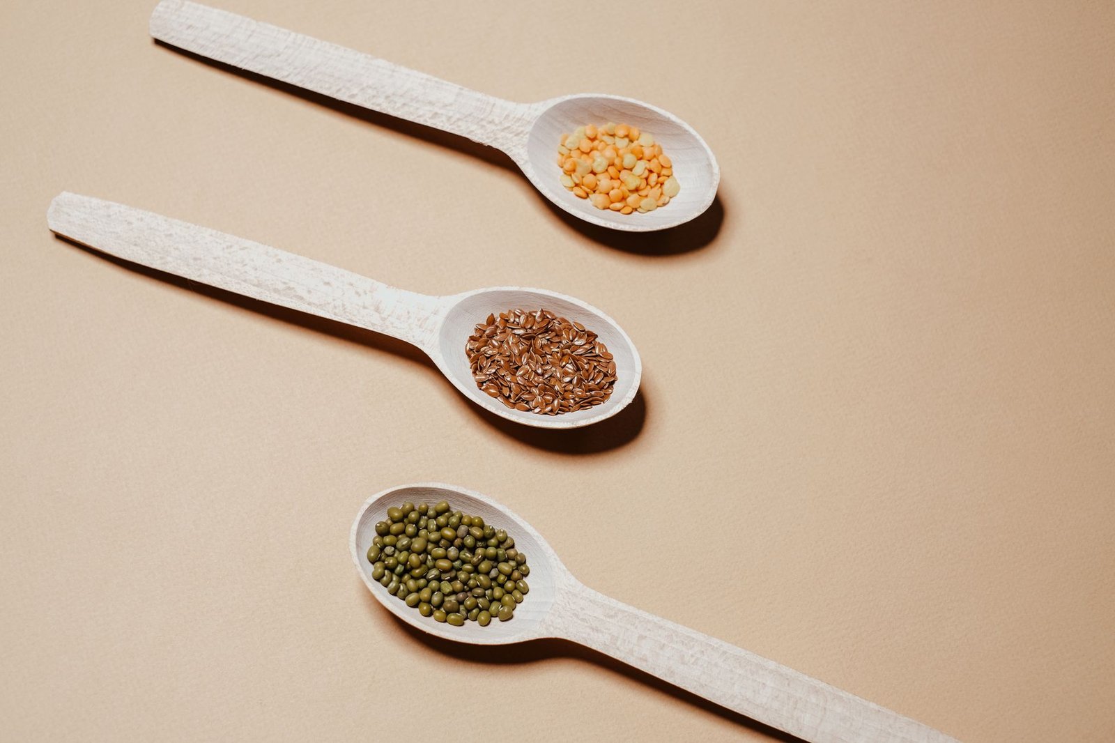 Flaxseeds on a wooden spoon